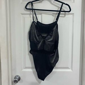 Black and grey body suit